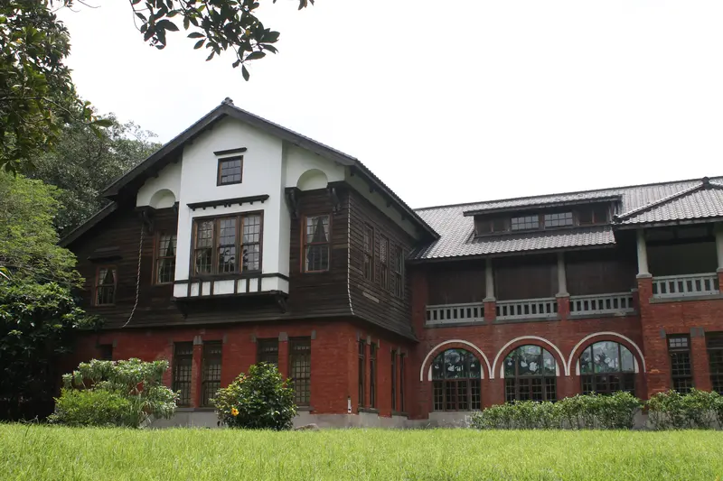 The historic Beitou Hot Spring Museum bathhouse in Taipei, with a red-brick lower storey and dark timber upper storey